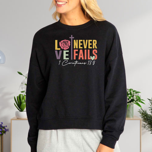 Love Never Fails Women's Fleece Crewneck Sweatshirt